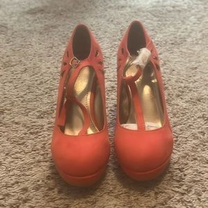New pair of red orange heels